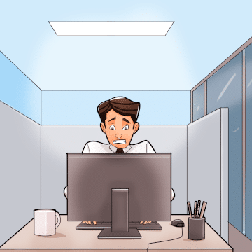 Concerned man in cubicle behind computer