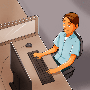 Man in a cubicle working at a computer